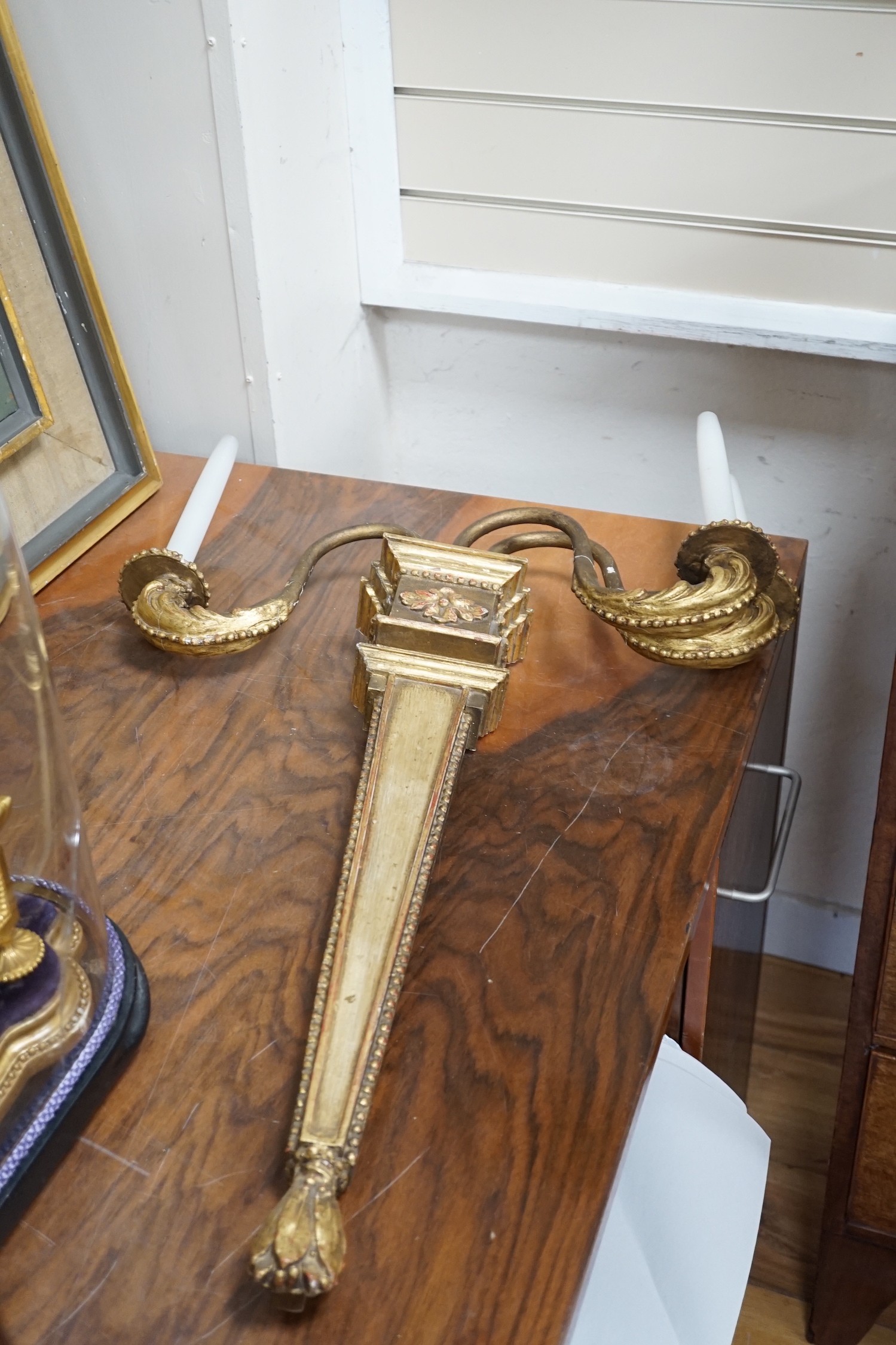 A pair of giltwood three branch wall lights, height 68cm *Please note the sale commences at 9am.
